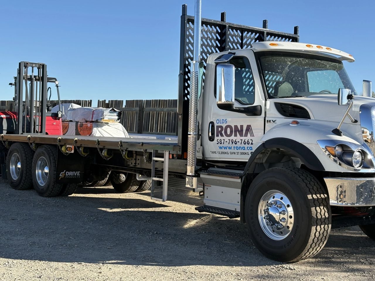 International HV607 Moffett truck with mounted forklift, delivered to Olds Rona